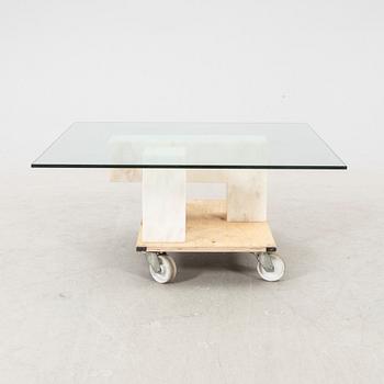 A late 20th century/21st century marble and glass coffee table.