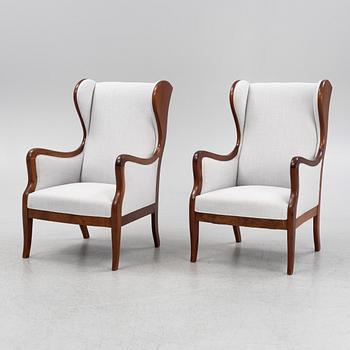 Frits Henningsen, attributed, a pair of wing back easy chairs, Denmark.