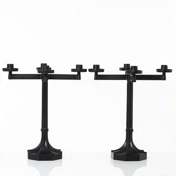 Sigurd Persson, a pair ofa cast iron candelabras, Kockums 1965.