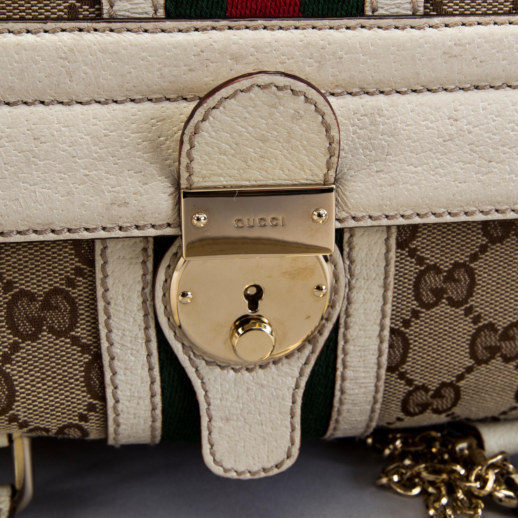 A Gucci canvas and leather hand bag.