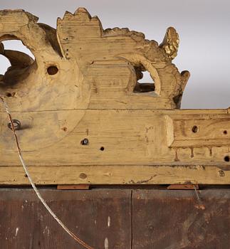 A presumably Dutch Louis XIV carved giltwood frame with mirror glass, in the style of Jean Le Pautre, late 17th century.