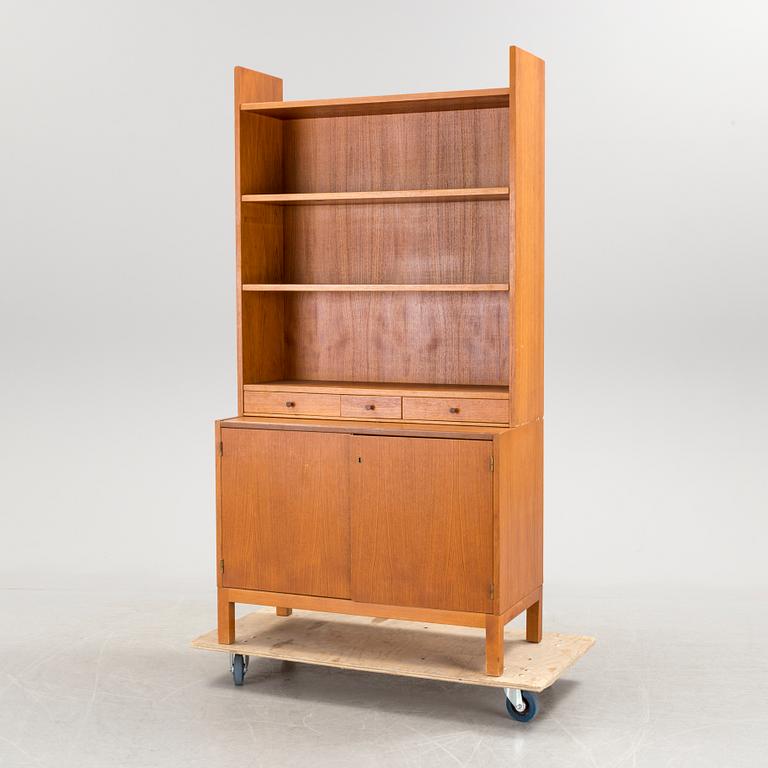 A teak vaneered book case, 1950's/60's.