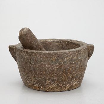 A llimestone mortar and pestle, 18th/19th Century.