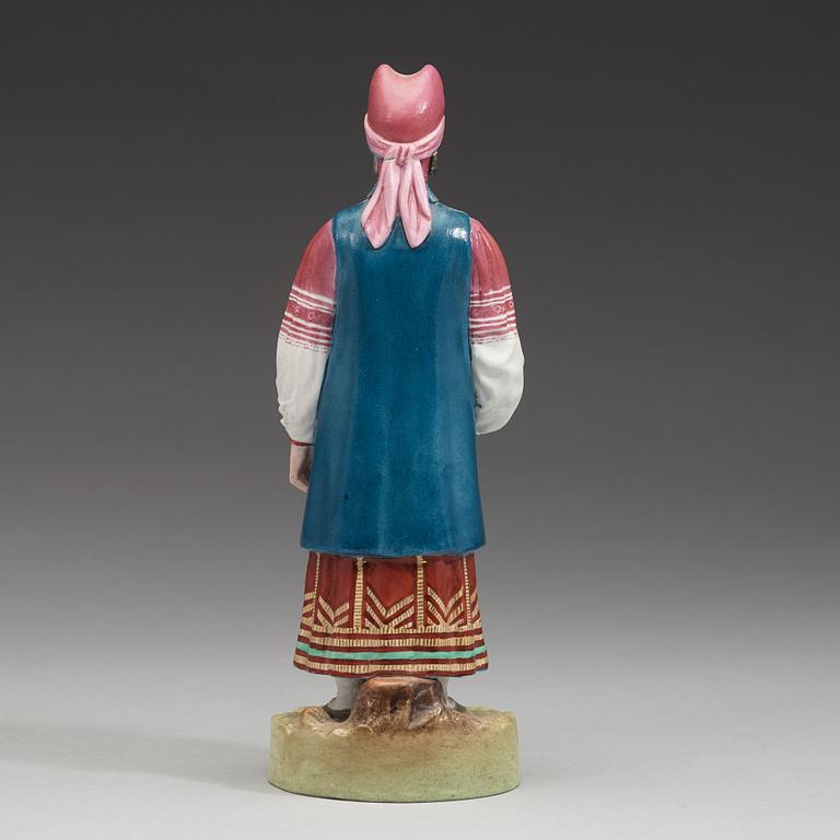 A Russian biscuit figure of a peasant woman from Kaluga, Gardner, Verbilki, Dmitrov gub, (1891-1917).