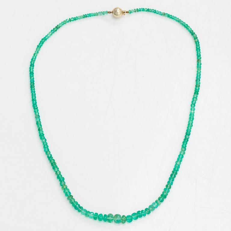 A necklace, set with emeralds, clasp in 14K gold.