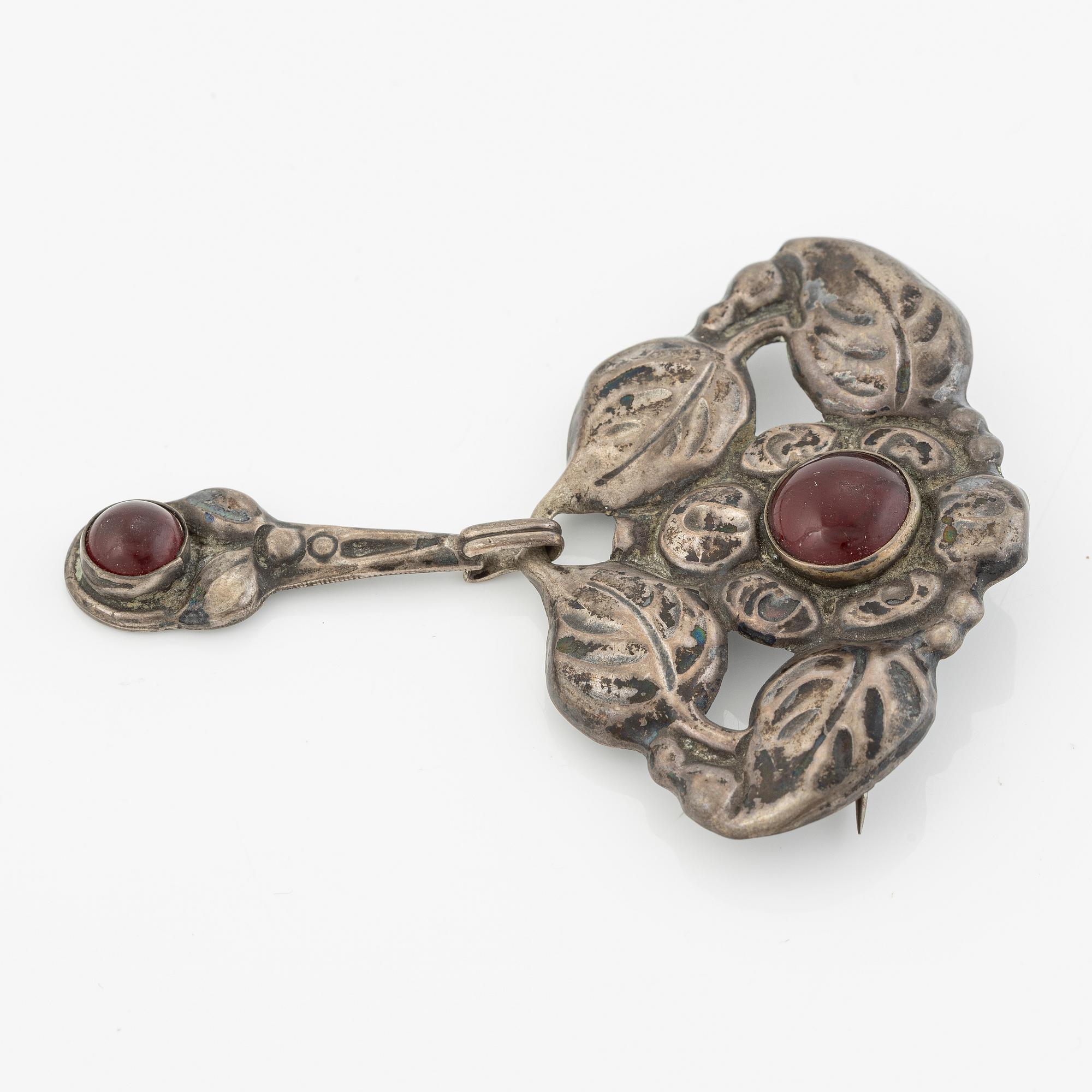 Brooch, Jugendstil, silver with red cabochon-cut stones.