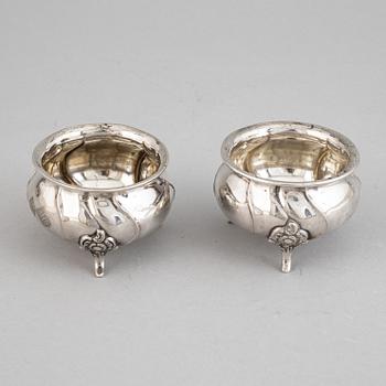 A set of eight rococo-style silver salt cellars, including CG Hallberg 1920.