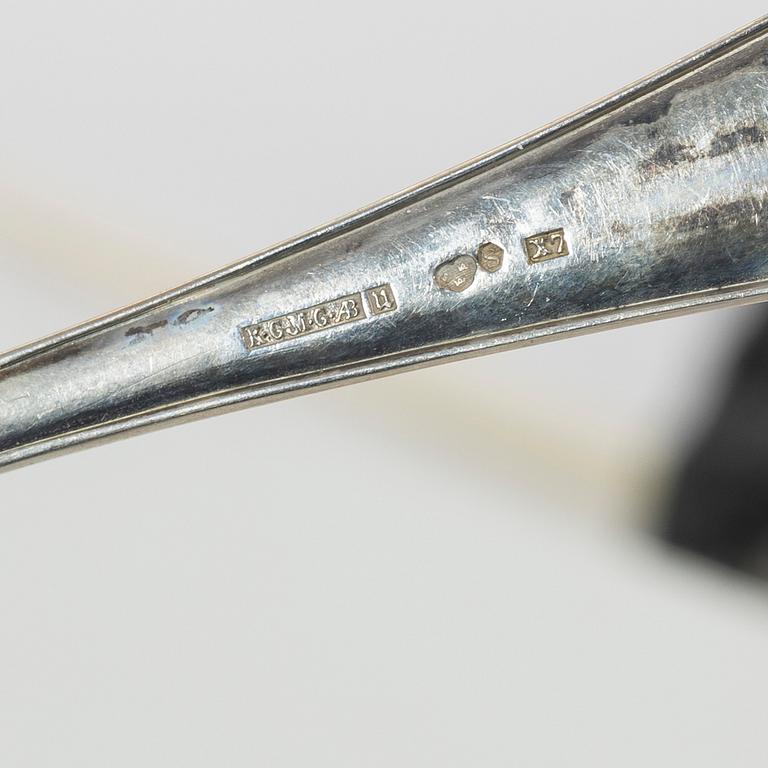 A set of silver cutlery and napkin rings, including with mark of Th Marthinsen, Tönsberg, Norway (14 pieces).