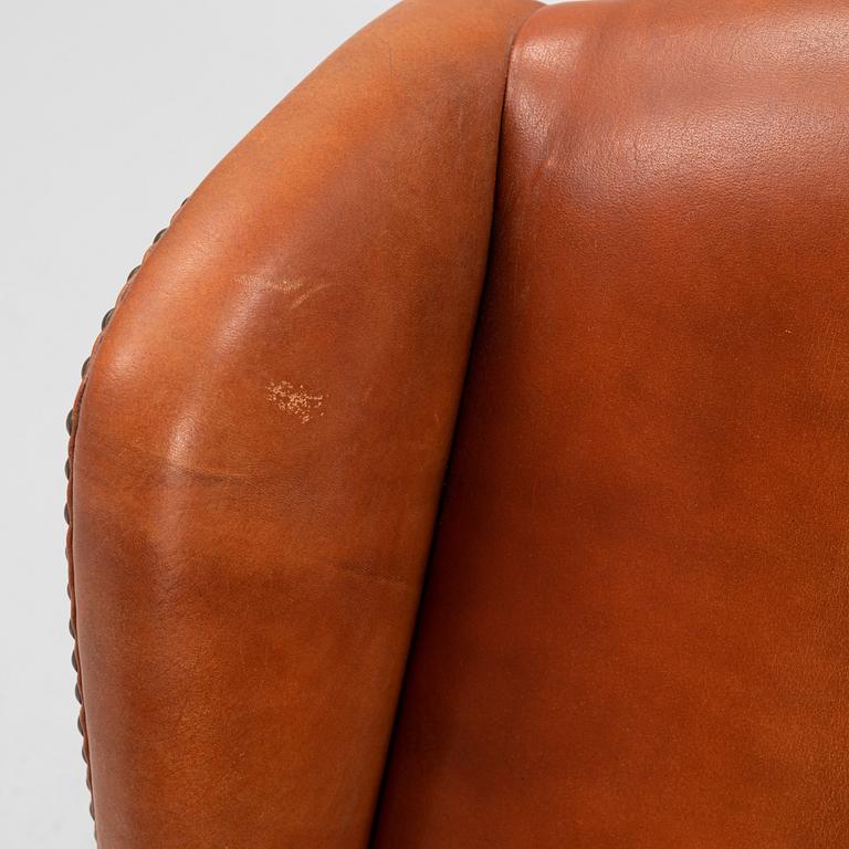 A leather upholstered easy chair, second part of the 20th Century.