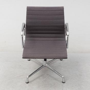 An 'EA 104 Swivel' armchair by Charles & Ray Eames, Vitra, 2007.