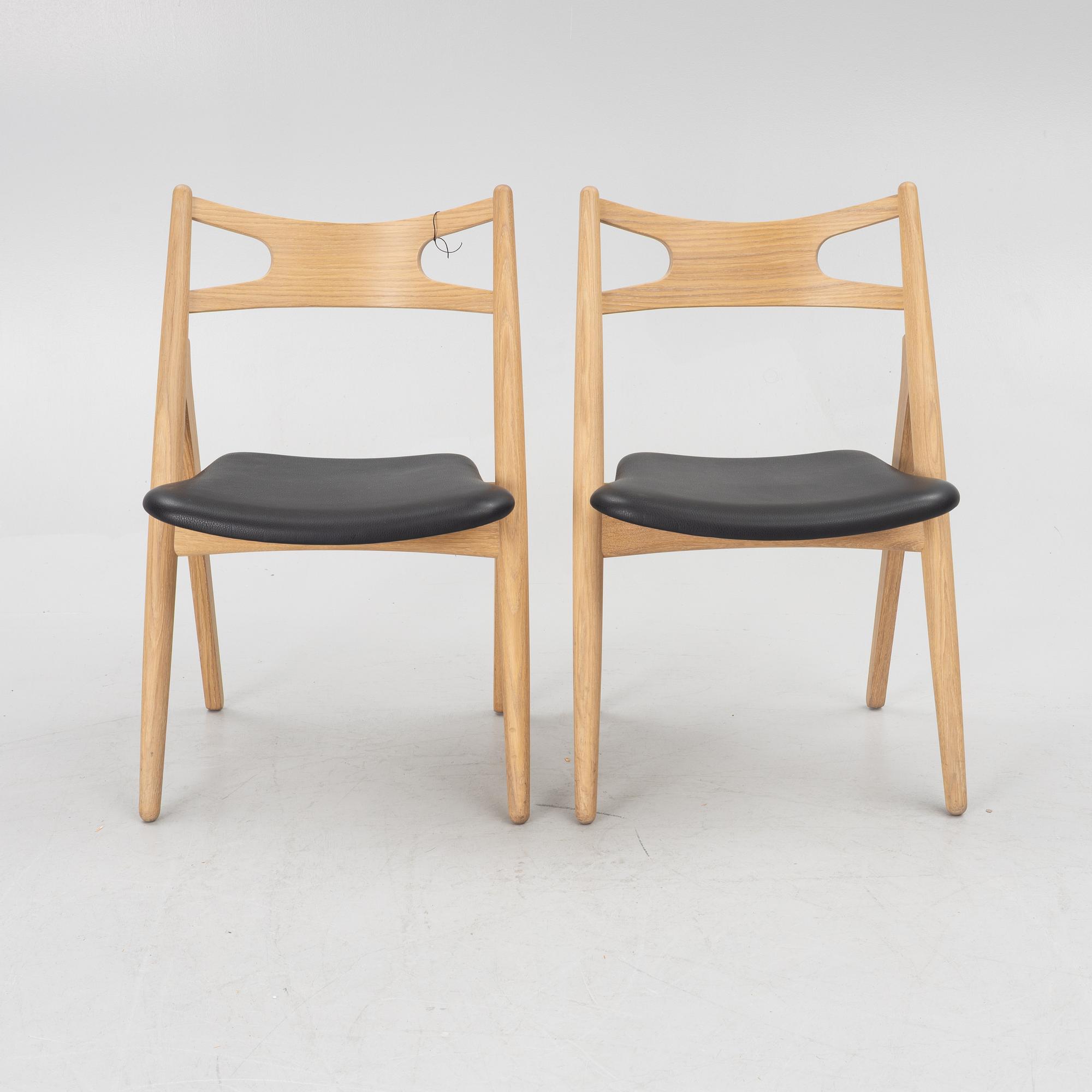 Hans J Wegner, a pair of chairs, model CH 29 "The Savbuk Chair", Carl Hansen.