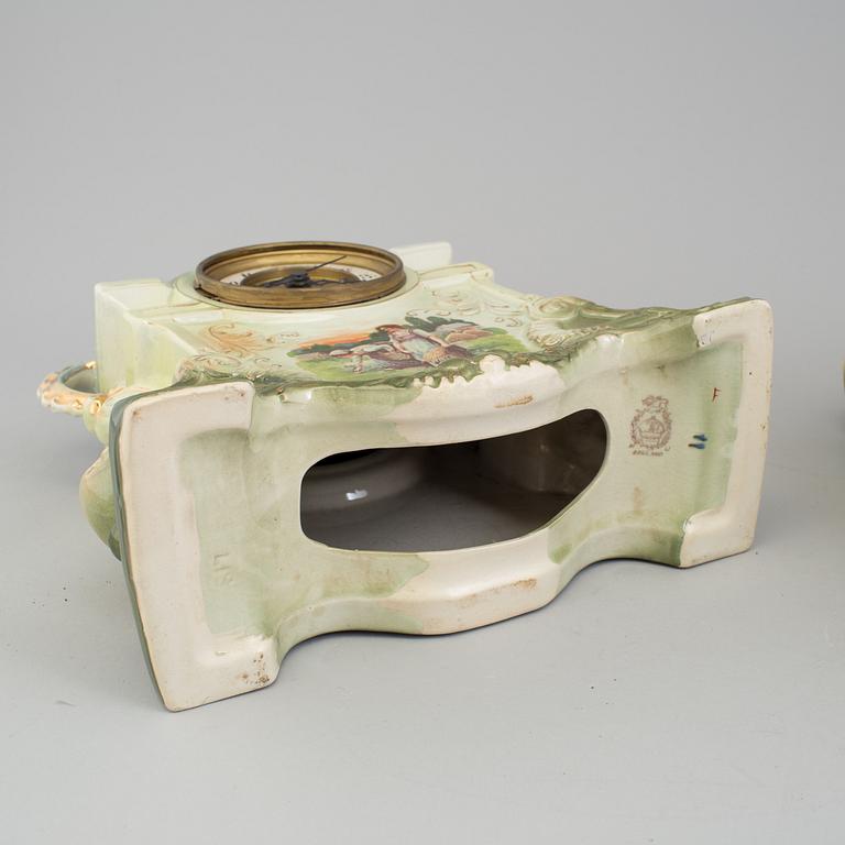 A creamware mantle clock, circa 1900.