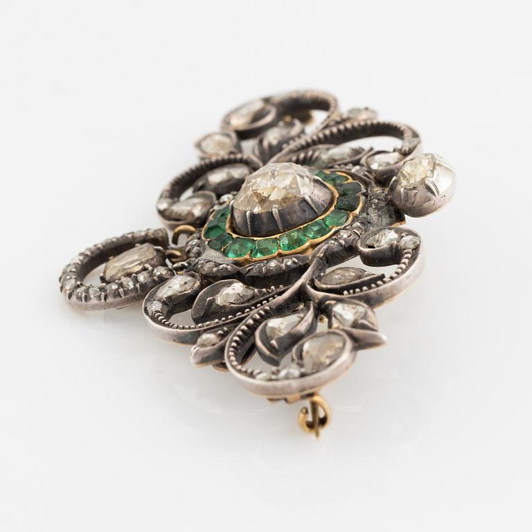 Gold and silver with rose cut diamond and emerald brooch.