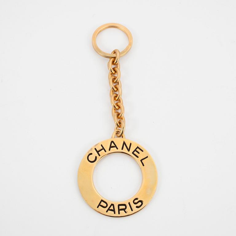 CHANEL, a golden key-ring.