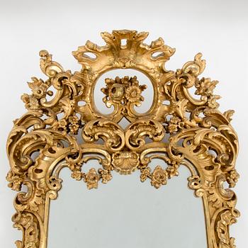 A late 19th century rococo style mirror abd console table.