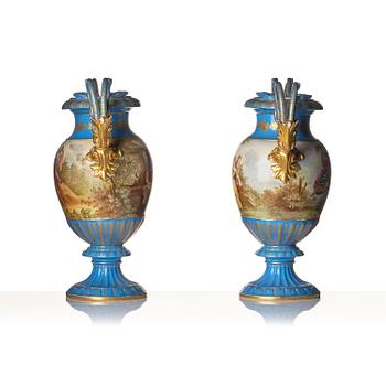 A pair of large porcelain urns, Sèvres like mark, around 1900.