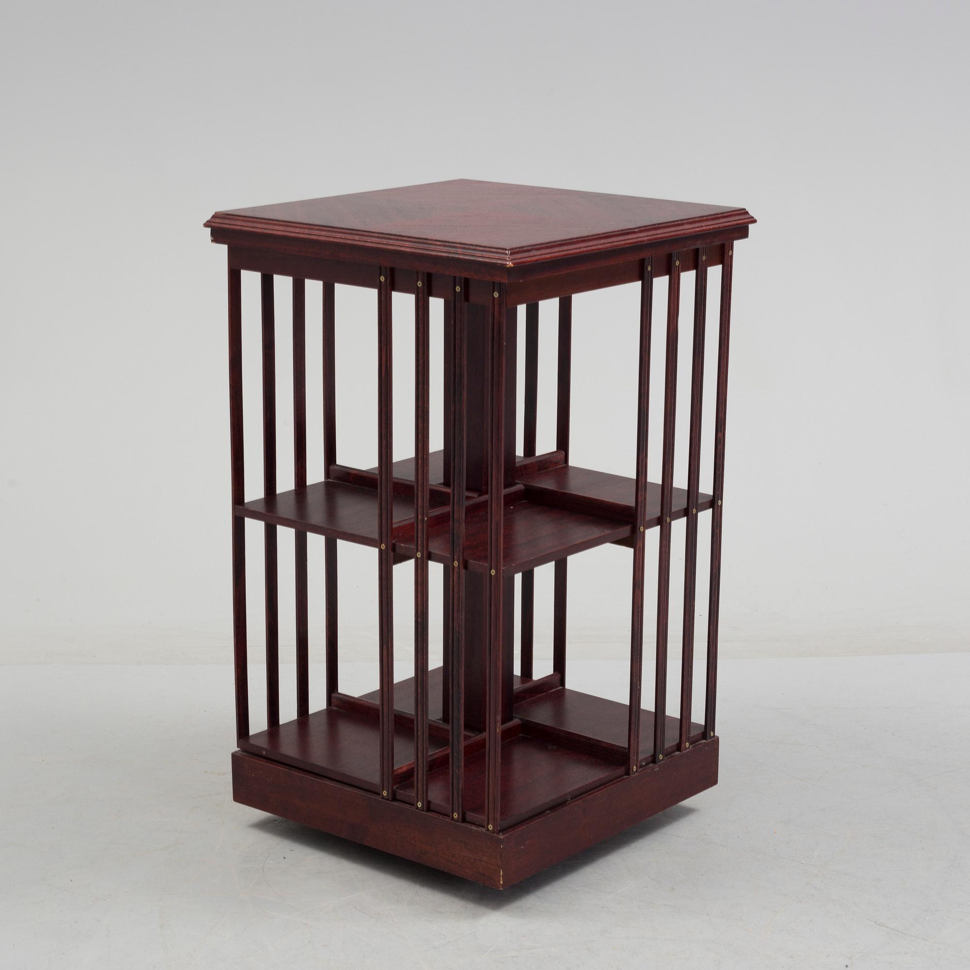 An second half of the 20th century turning book shelf veneered with mahogny.