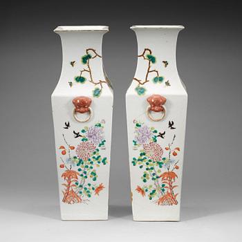 303. A pair of famille rose vases, Qing dynasty, late 19th Century.