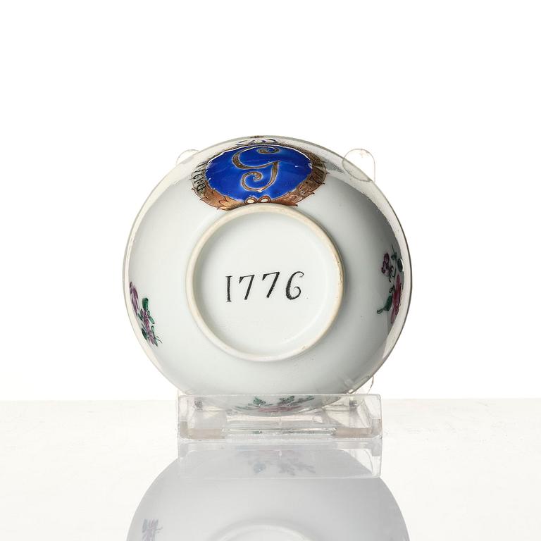 A famille rose armorial cup and stand with the monogram of the Swedish King Gustavus III, Qing dynasty, 18th century.