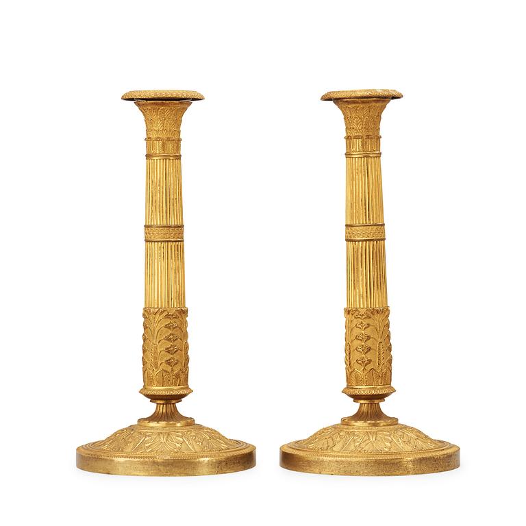 A pair of French Empire early 19th century candlesticks.