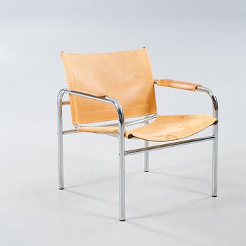 An armchair designed by Tord Björklund, named "Klinte" and made in the fourth quarter of the 20th century.