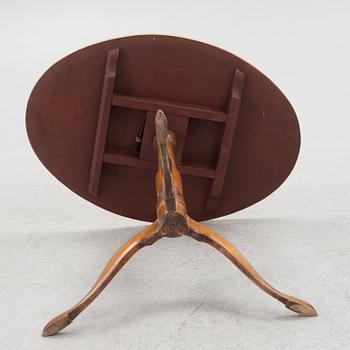 A 19th Century birch tilt top table.