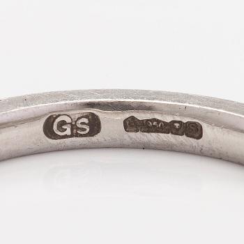 A platinum ring with brilliant cut diamonds.