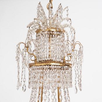 A German Louis XVI gilt-brass and cut-glass six-light chandelier, late 18th century.