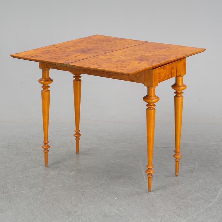 An early 20th Century birch card table.