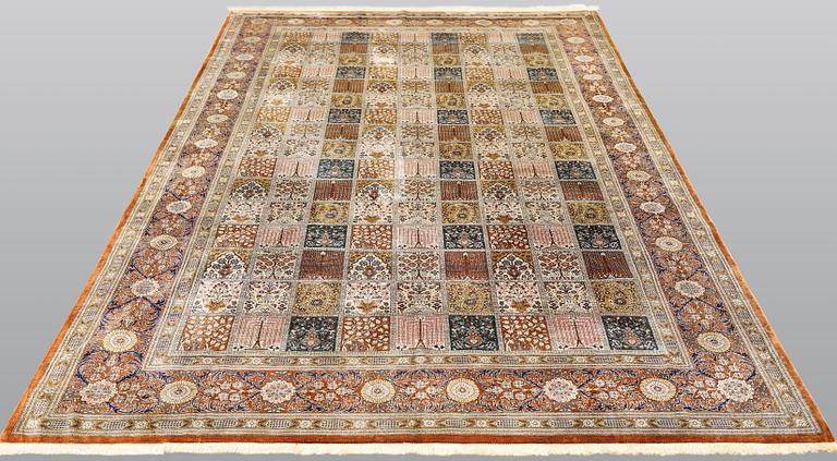 A silk Ghom carpet, 296 x 194 cm.
