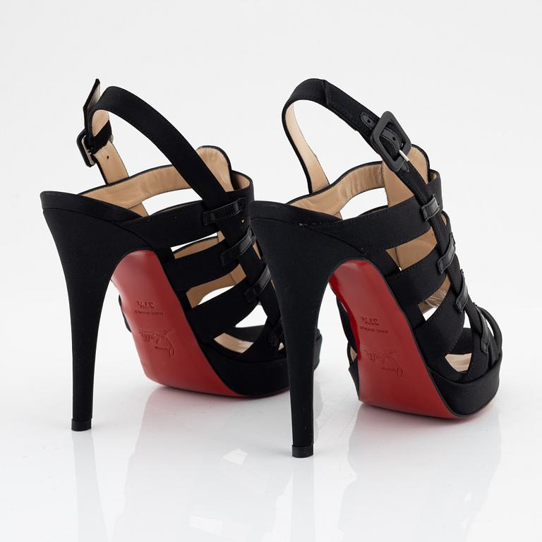 Christian Louboutin, a pair of black silk sandals, size 37 1/2.