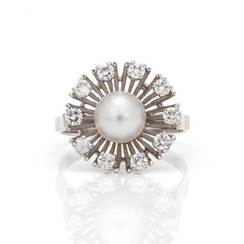 A ring with a cultured pearl surrounded by round, brilliant-cut diamonds.