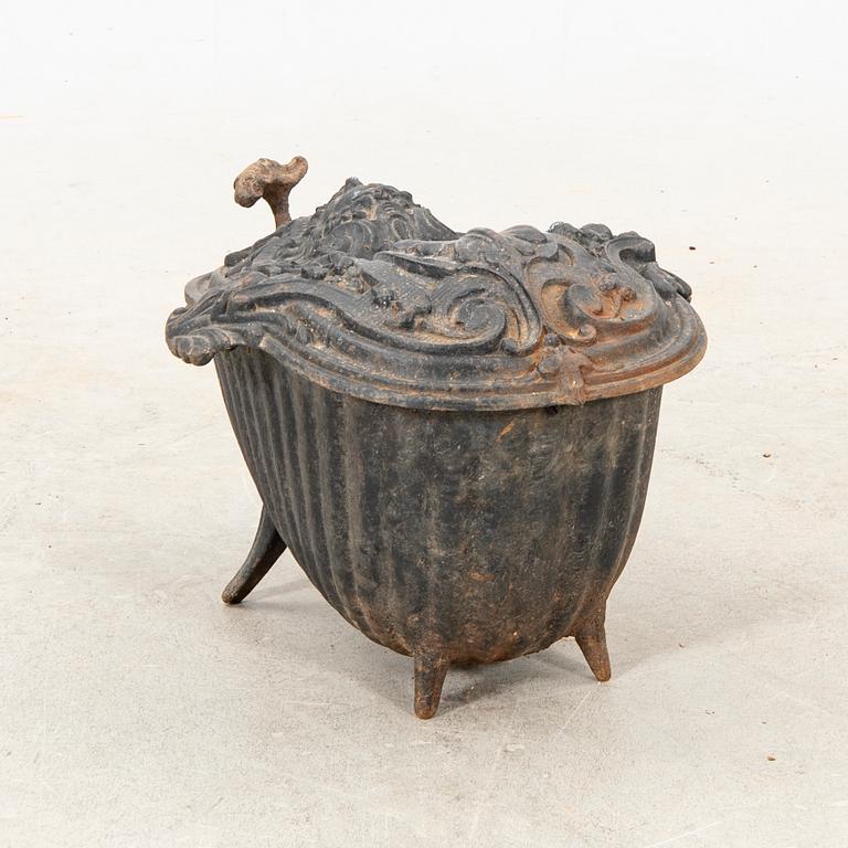 An iron cast coal box Corneau Freres Charleville France around year 1900.