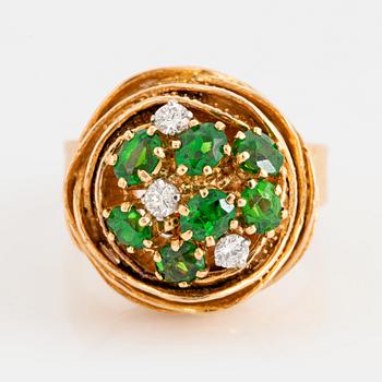 1010. An 18K gold WA Bolin ring set with demantoid garnets and round brilliant-cut diamonds.