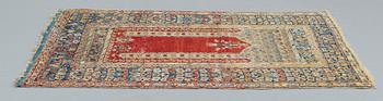 A RUG, an antique Anatolia, probably Gördes, a prayer rug, ca 177 x 124,5 cm (as well as flat weave at the ends 3 and 1.