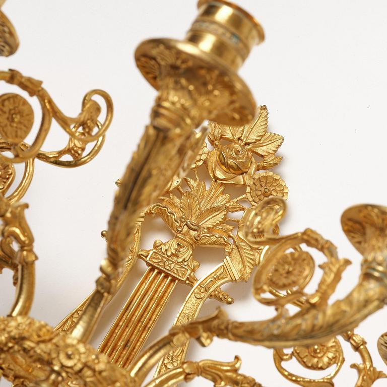 A pair of French 19th century gilt bronze five-light wall-lights.