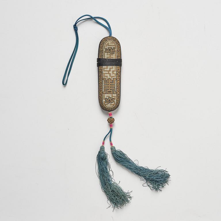 A set of three embroidered purses/ eye-glass cases, Qing dynasty, 19th century.