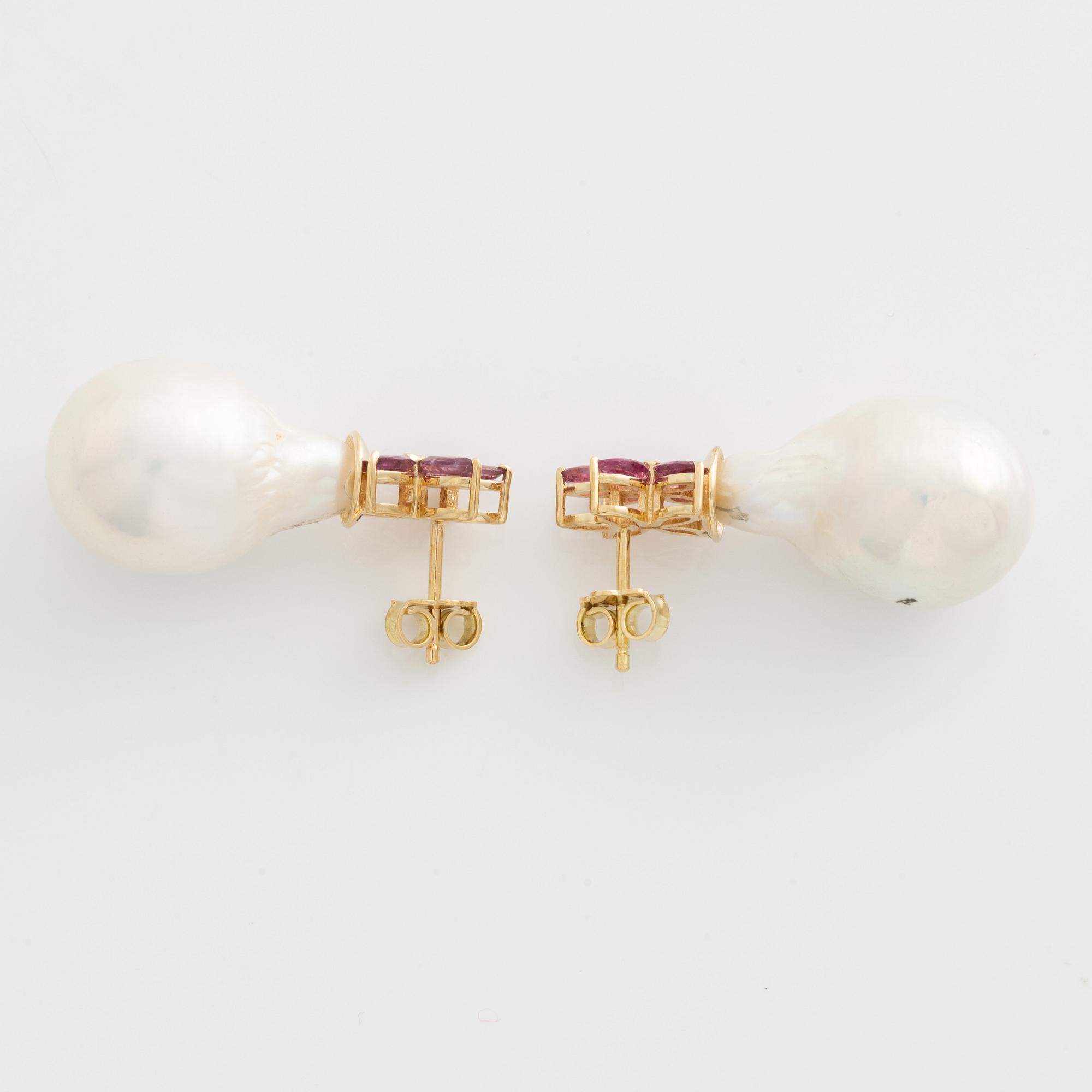 Earrings with cultured baroque freshwater pearls and pink sapphires.