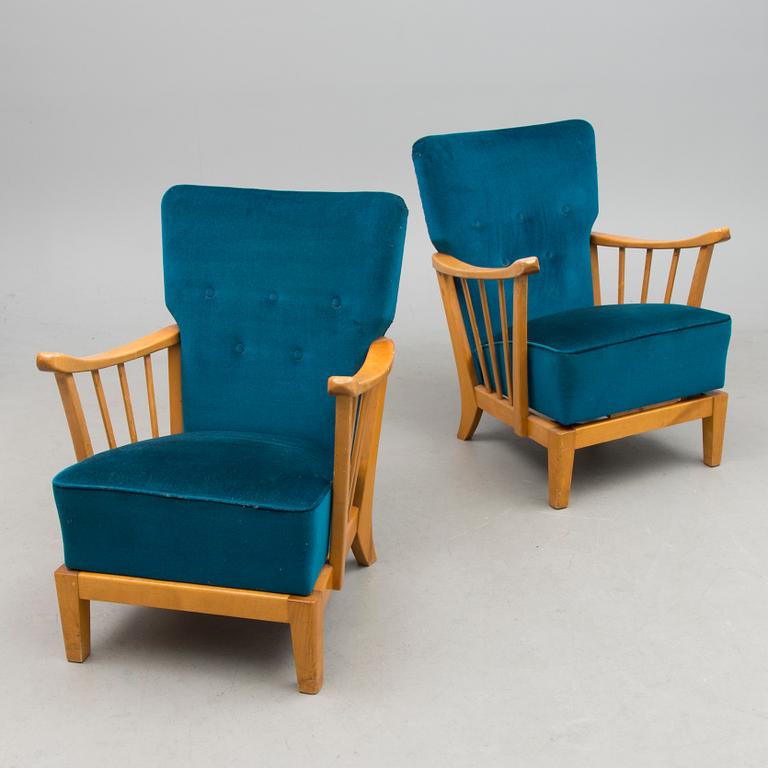 A pair of mid 20th century '2402 Armi' armchairs by Ilmari Lappalainen/Olavi Lieto, Asko, Finland.