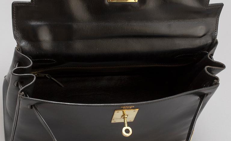 HERMÈS, a black leather 'Kelly' bag, 1970.