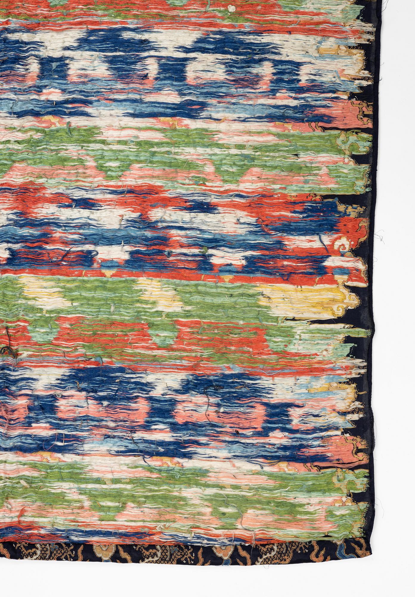 A set of three bolts of silk with 'five clawed dragons' against a midnight blue ground, Qing dynasty, 19th century.