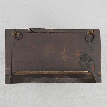 A hanging cabinet, dated 1870.