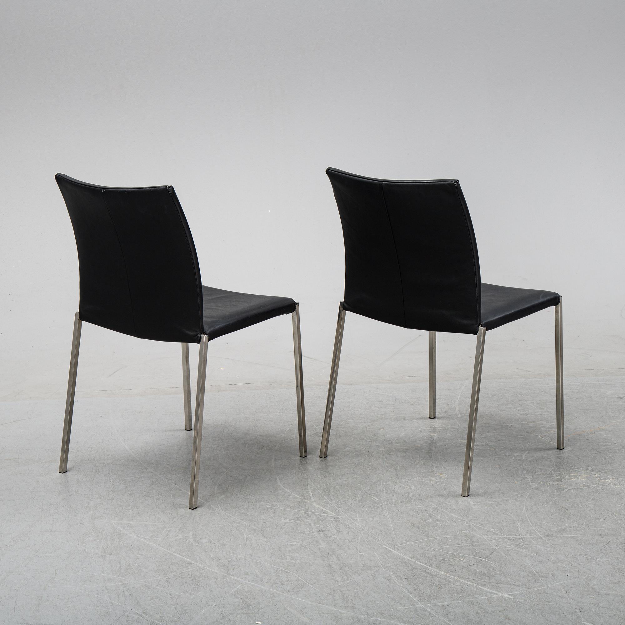 A set of eight steel and leather chairs, 21th century.