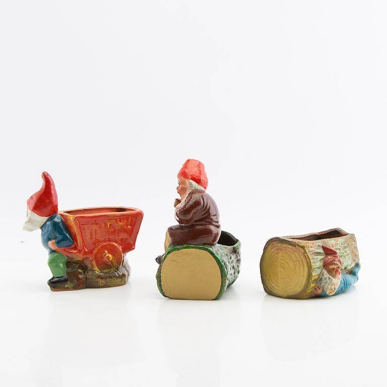 A collection of gnomes 12 pcs mid/late 20th century mostly painted terracotta.