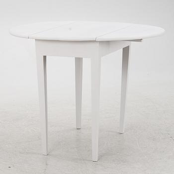 A drop-leaf table, late 19th Century.