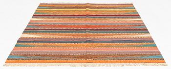 A Persian Kilim rug, c. 247 x 180 cm.