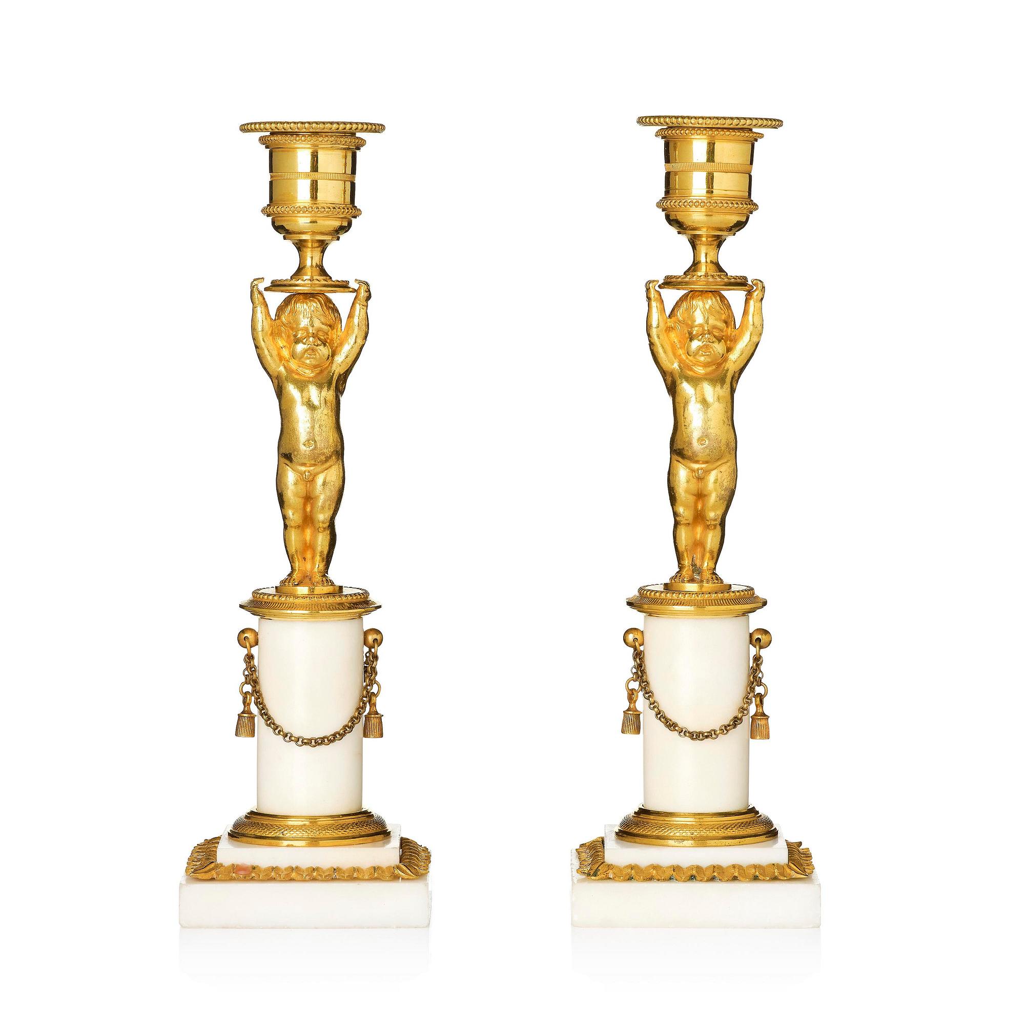 A pair of late Gustavian ormolu and white marble candlesticks, Stockholm, late 18th century.