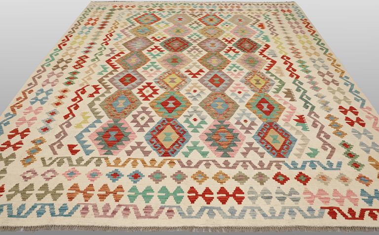 A Kilim rug, approx. 299 x 250 cm.