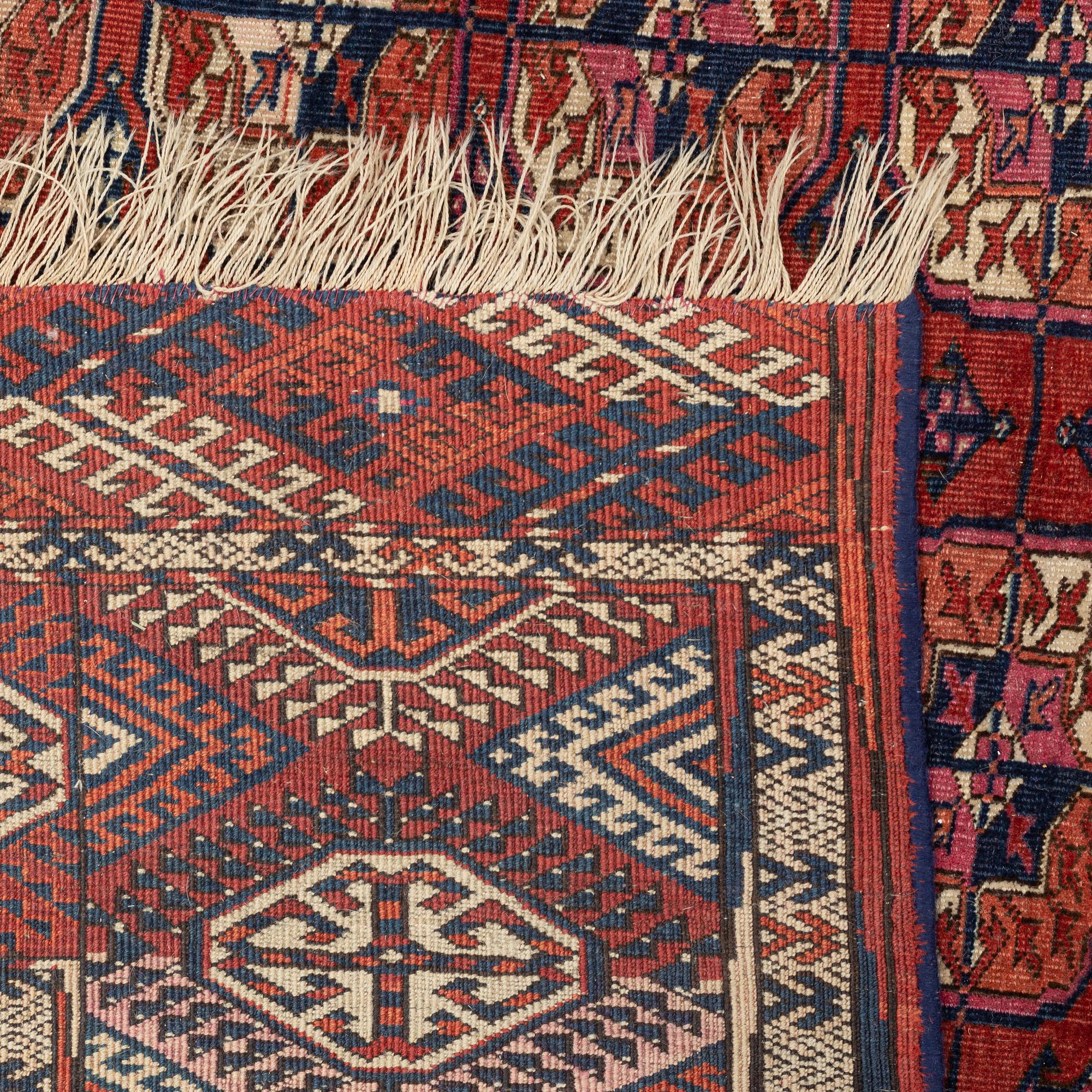A Tekke carpet, c. 305 x 225 cm.