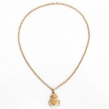 Necklace in 14K gold, with a pendant in the shape of a scarab.